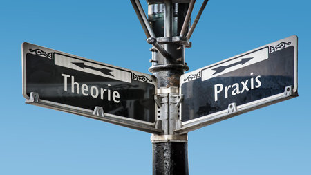 An image with a signpost pointing in two different directions. One direction points to practice, the other points to theory.の写真素材