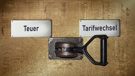 An image with a signpost pointing in two different directions in German. One direction points to Tariff Change, the other points to Expensive.の写真素材