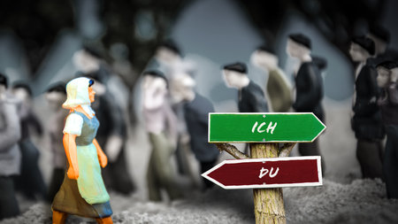 An image with a signpost pointing in two different directions in German.の写真素材