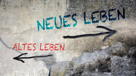 An image with a signpost pointing in two different directions in German. One direction points to New Life, the other points to Old Life.の写真素材