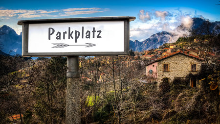 An image with a signpost in German pointing towards the parking lot.の写真素材