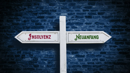 An image with a signpost pointing in two different directions in German. One direction points to a fresh start, the other points to bankruptcy.の写真素材