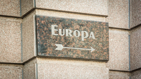 picture shows a signpost and a sign pointing towards Europe in German.の写真素材
