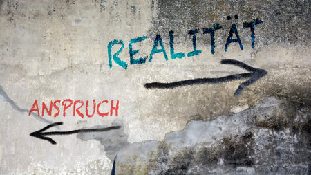 An image with a signpost pointing in two different directions in German. One direction points to...