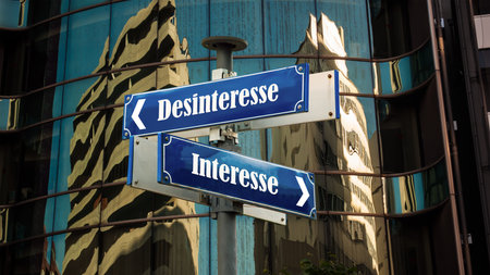 An image with a signpost pointing in two different directions in German. One direction points to interest, the other points to disinterest.の写真素材