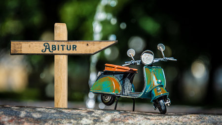 Image with a signpost pointing in the direction of life's high school diploma and graduation