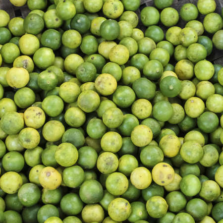 Limes on a market in Cambodiaの写真素材