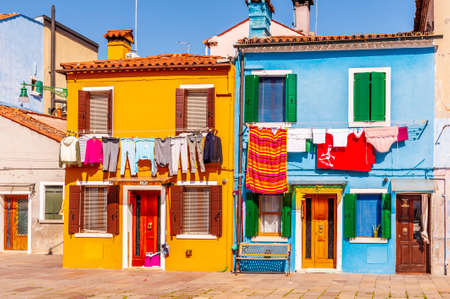 Square with colorful facades on the island of Burano in Venice in Veneto, Italyの写真素材