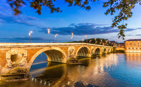 Magnificent Pont Neuf and its reflections on the Garonne river in the evening in Toulouse, Haute Garonne, Occitania, Franceの写真素材