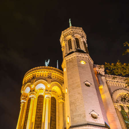 The rear of the Notre Dame de Fourviere Basilica at night in Lyon, in the Rhone, Franceの写真素材