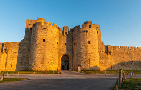 Gate and east ramparts, Aigues-Mortes in the early morning, in the Gard in Occitanie, Franceのeditorial素材
