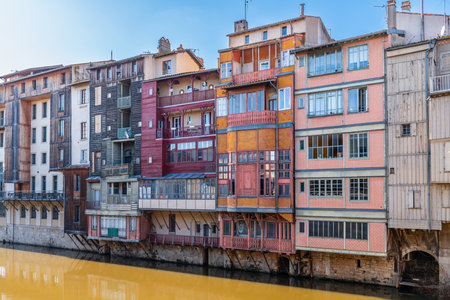 Facades of houses in the town of Castres on the Agout River in Occitanie, France