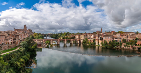 Sainte CÃ©cile cathedral and the banks of the Tarn, from the Pont Neuf in Albi, in the Tarn, in Occitanie, Franceの写真素材