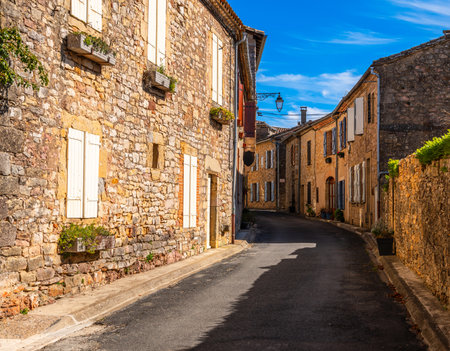 A street in the medieval village of Puycelsi, in the Tarn department, Occitanie region, Franceの写真素材