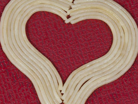Spaghettiheart red background 1の写真素材