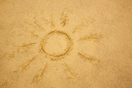 Writing in Sand: Sun Symbolの写真素材