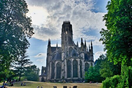 Saint-Ouen Abbey in Rouen in Normandy, France. Gothic style. View of the gardens of the Hotel de...
