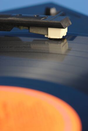 vinyl record player, macro close-up of the head and tonearm