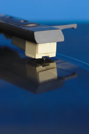 vinyl record player, macro close-up of the head and tonearm