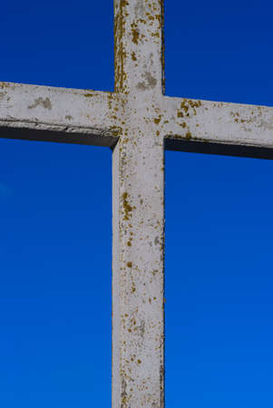 White cement cross on blue sky backgroundの写真素材