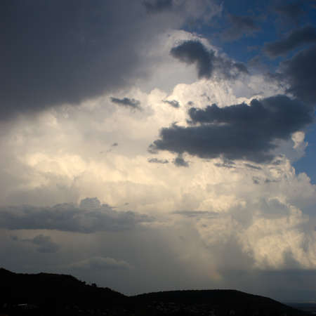 background of light and dark clouds on blue sky, backgroundの写真素材