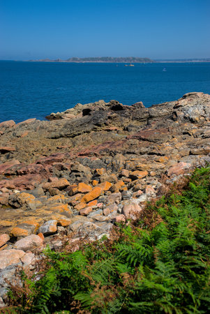 Monolithic blocks of pink granite in the Cotes d'Armor in Brittany, France. pink granite coast
