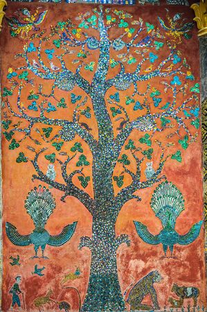 A large mural named a tree of life was set in colored glass mosaics at Wat Xieng thongの写真素材