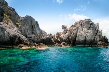 Wooden cottage on top of rock island, bird nest island in southern Thailand.の写真素材