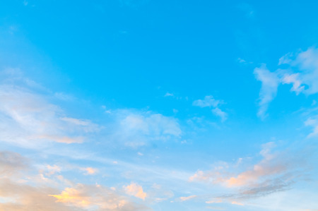 Summer blue sky with scatttered clouds.の写真素材