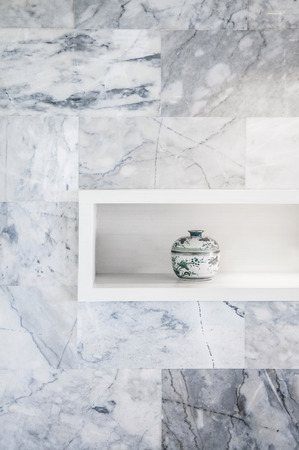 Chinese Pottery home decoration and grey mable wall.の写真素材