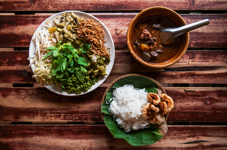 Thai rice noodle or vermicelli with northern style curry and vegatables plateの写真素材