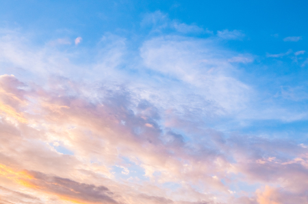 Half blue and half golden evening sky.の写真素材