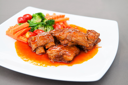 Pot roasted por ribs with tomato base sauce.の写真素材