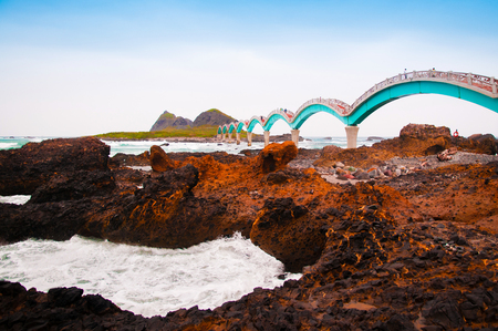 Black rocks beach and Sanxiantai dragon bridge, Taitung, Taiwan.のeditorial素材