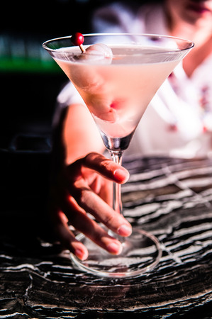 Lychee Martini cocktail in woman's hand.の写真素材