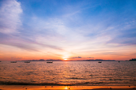Scene of Tropical Sunset sea and fishing boat, Krabi, Thailandの写真素材