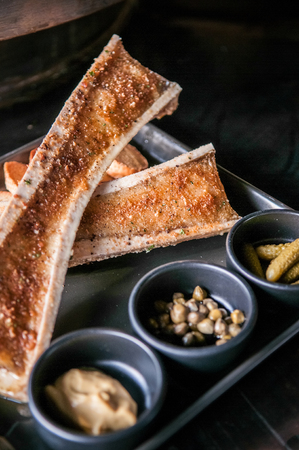 Roasted beef bone marrow and Grilled Bread Slicesの写真素材