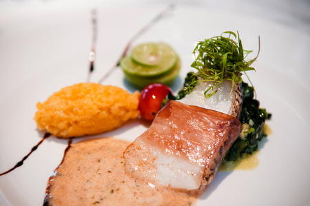 Grilled cod fish wrapped with pamaham, spinach and omelette
