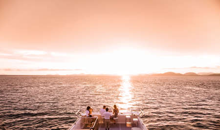 Tourists enjoy sunset cruise in phuket
