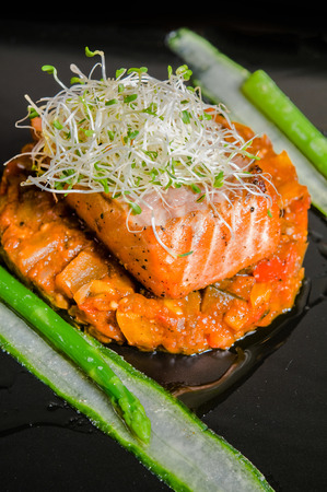 Salmon steak with ratatouille and asparagusのeditorial素材