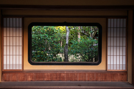 Japanese Garden Visible Through The Japanese style window and wall.の写真素材