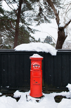 JAN 22, 2014 AKITA, JAPAN : Japanese vintage mailbox covered with snow at Kakunodate, Akita, Japan.のeditorial素材