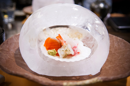 Fresh Japanese sashimi set in ice domeの写真素材