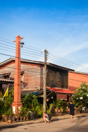 MAY 20, 2014 Koh Lanta, Thailand : Koh Lanta City, Koh Lanta old town wooden house along the street in fisherman village with tourists exploring and taking photoのeditorial素材