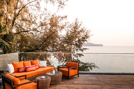 Beautiful sunset lounge with nice ocean view in tropical island resort, Phuket, Thailandの写真素材