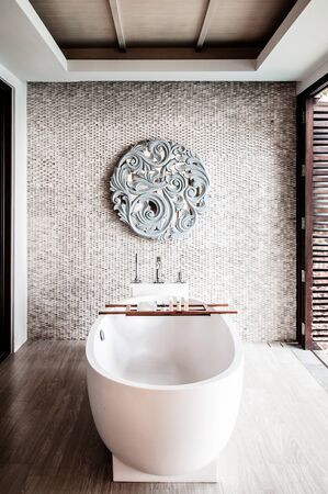 MAR 28, 2014 Phuket, Thailand : White Terrazzo bathtub in luxury resort style bathroom with...