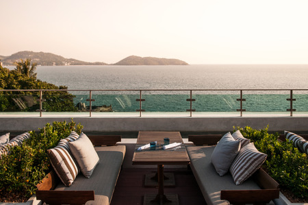 MAR 28, 2014 Phuket, Thailand : Sunken seating lounge at luxury resort with ocean view in evening, Phuket, Thailandのeditorial素材