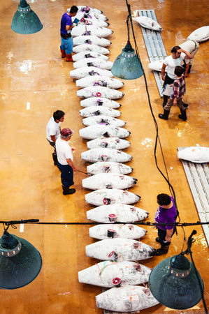 JUN 26, 2014 Kawasaki, Japan : Merchants in Japanese fresh fish market during tuna fish auction in morningのeditorial素材