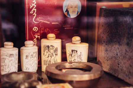 MAR 1, 2018 Uthaithani - Thailand : Rustic vintage country house interior concept -  ivory snuff opium bottle, tea box, ashtrayのeditorial素材