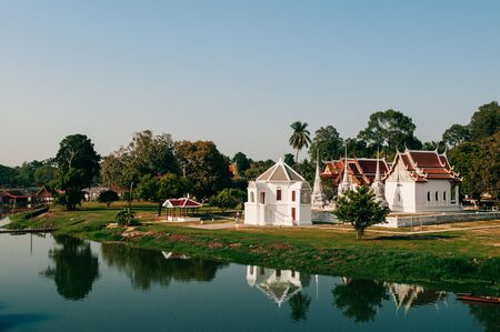 MAR 1, 2018 Uthaithani - Thailand : Wat Uposatharam Temple or Wat Bot by the calm river with reflection on river surface, Historical landmark of Uthaithani provinceの写真素材